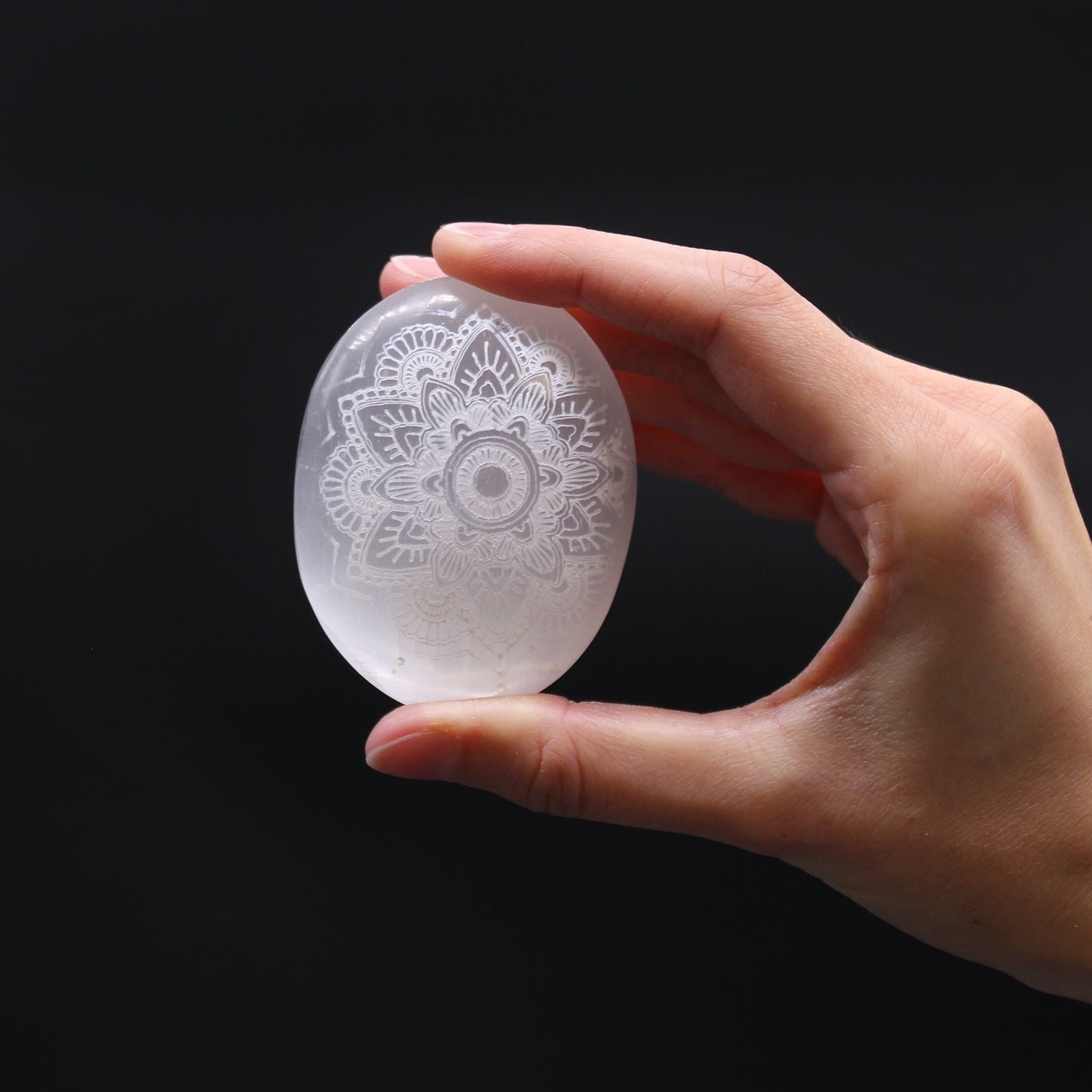 Selenite Palm Stone - Mandala Engraved – lifestyle shot