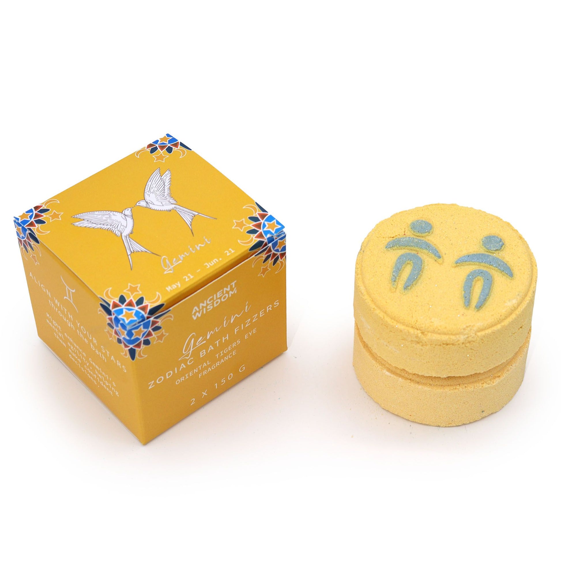 Yellow bath fizzer with packaging on a white background