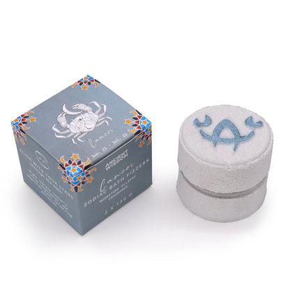 Bath fizzer with packaging featuring a zodiac design on a white background