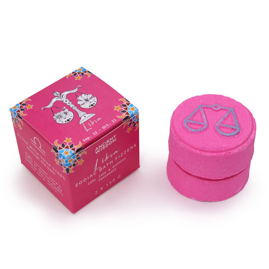 Pink zodiac-themed bath fizzer set with Libra symbol on a white background