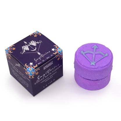 Purple bath bomb with decorative box on a white background