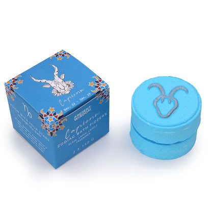 Blue container with Capricorn symbol and packaging on a white background