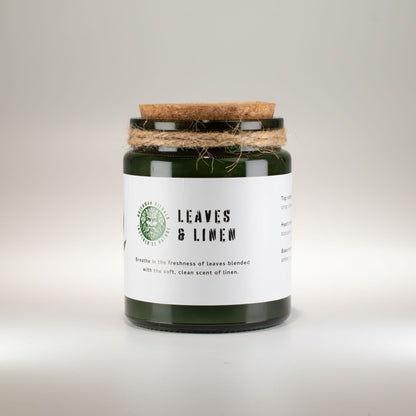 Greenman Woodwick Soy Candle - Leaves & Linen – lifestyle shot