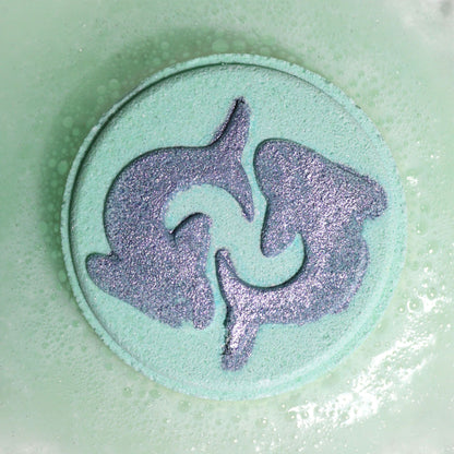 Decorative soap with a dolphin design on a light green background