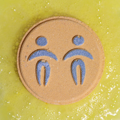 Circular patch with blue figures on a textured green background