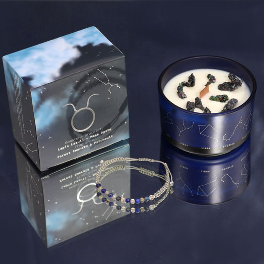 Candle with decorative elements and packaging on a dark background